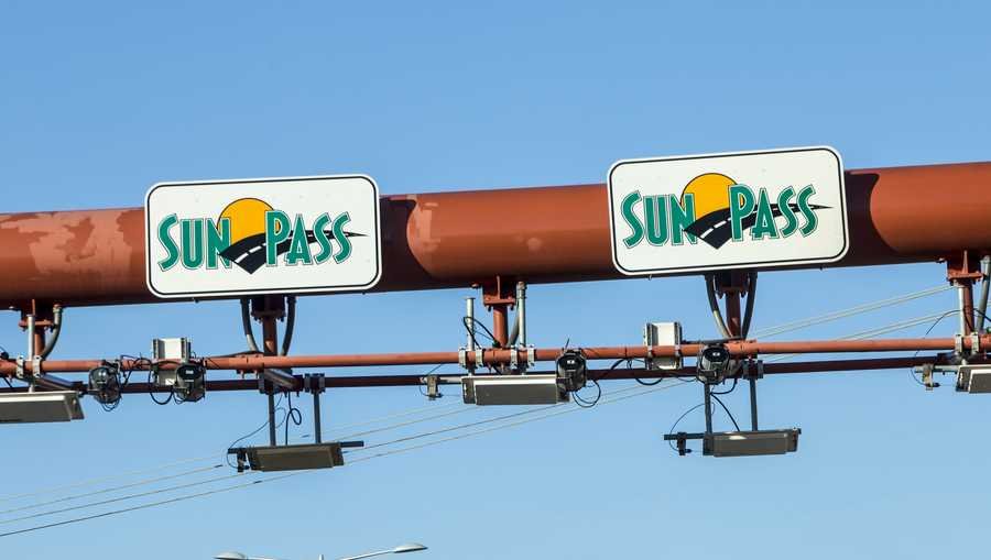 Miami, USA - August 27, 2014: Sunpass lane at the Miami Highway in Miami, USA. Sunpass lane on left hand side is for toll only and enables electronical payment. SOURCE: travelview
